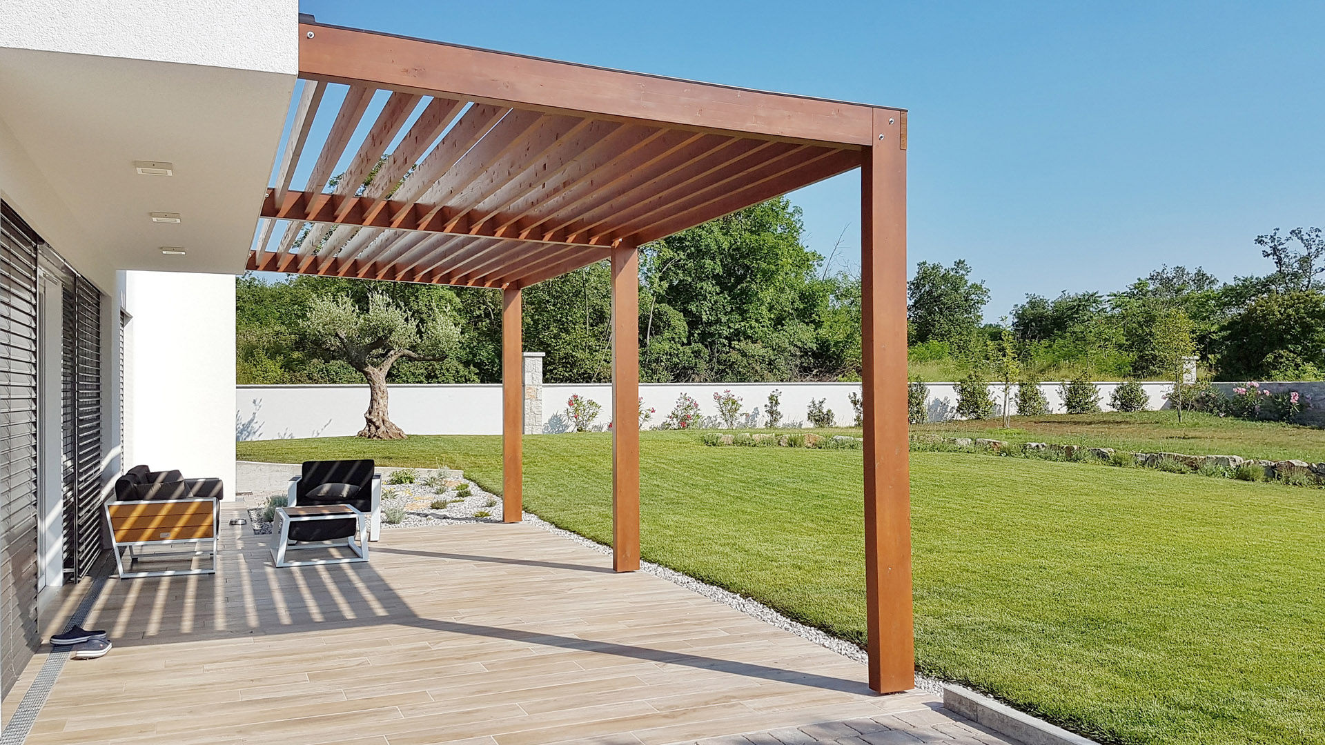 Pergola on passive house with large panoramic windows